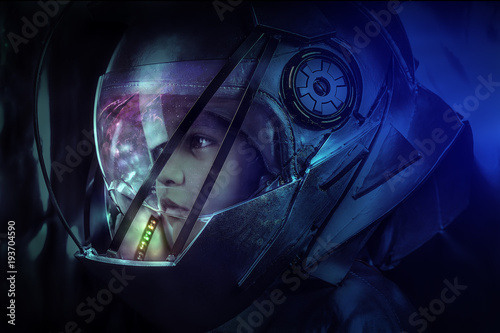 Fotografie child of the future with space helmet and colored LEDs inside the helmet