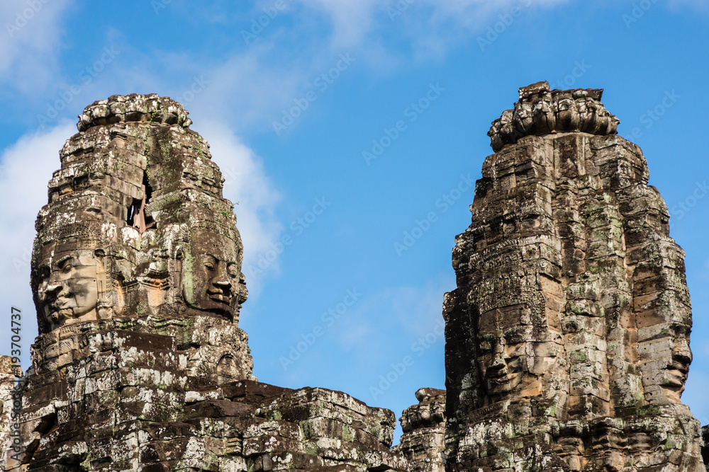 Stone faces in Bayon temple in Angkor Thom, Cambodia Stone faces in Bayon temple in Angkor Thom, Cambodia