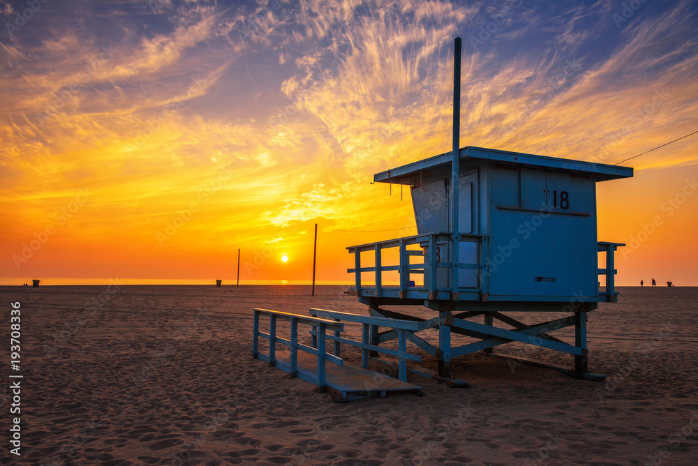 Sunset over Santa Monica beach with lifeguard observation tower