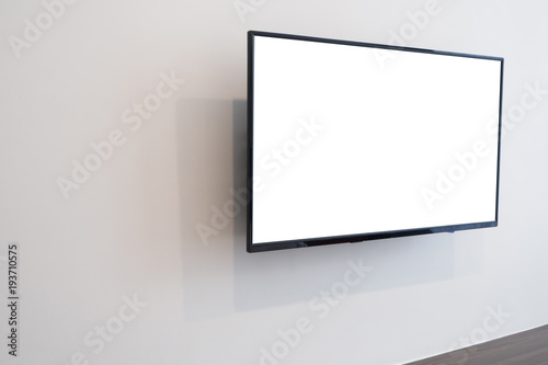 White blank screen television on concrete wall at living room. copy space for text on TV.