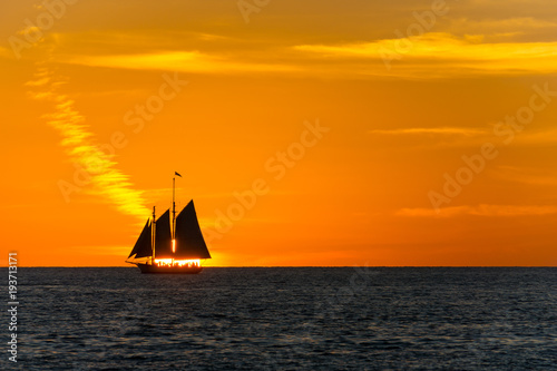 USA, Florida, Sunset behind ancient sailing ship