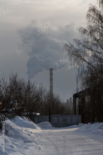 smoking pipes in an industrial area