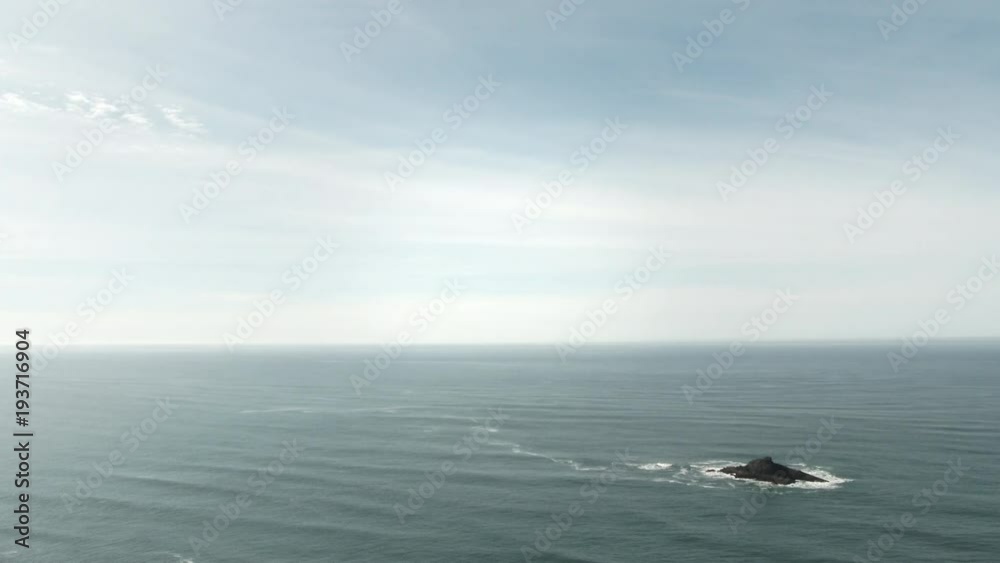 Open space minimalism with empty sky ready for text or graphic above wide ocean horizon on bright day. Open space minimalism with empty sky ready for text or graphic above wide ocean horizon on bright day.