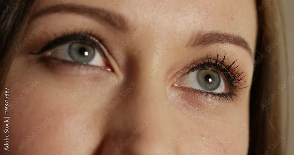 4k, Close up shot of an attractive happy and cheerful woman deep in her thoughts. 4k, Close up shot of an attractive happy and cheerful woman deep in her thoughts.