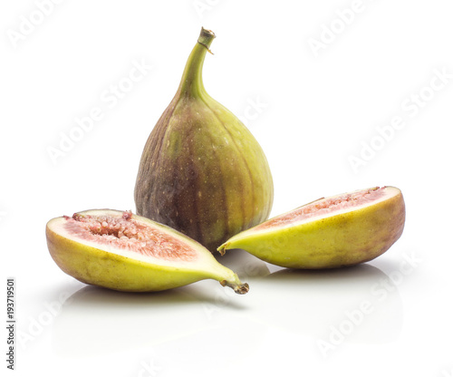 One whole fig and two sliced halves with rose flesh isolated on white background ripe fresh purple green. photo