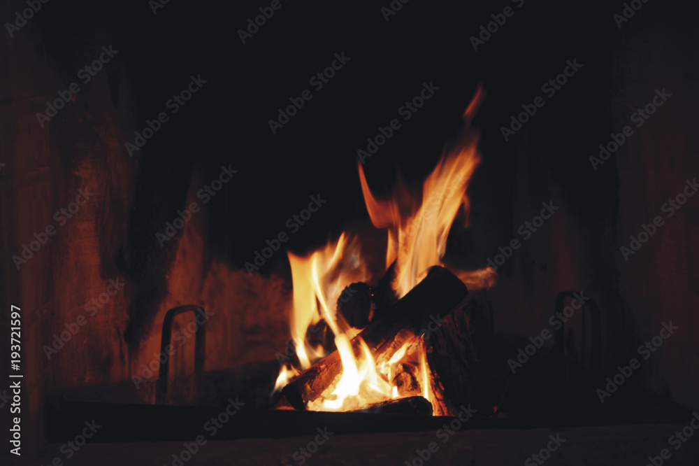 Close up of burning firewood in the fireplace Close up of burning firewood in the fireplace