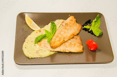 pike-perch pieces with white sauce photo