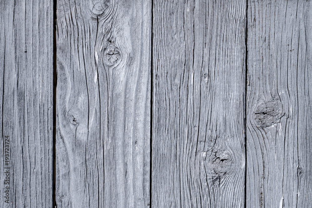 Naklejka premium Grey wooden texture of a barn door