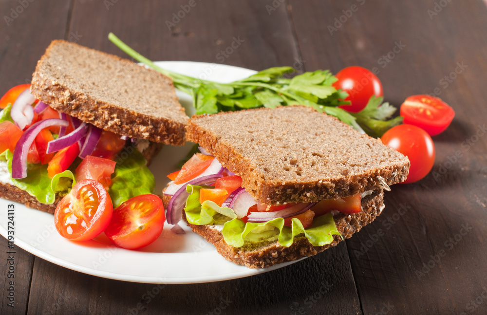 Vegan burger or sandwiches with rye bread, different vegetables and sprouts. Concept of healthy eating or vegetarian food.