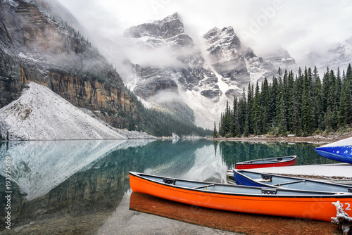 Autumn Snow at Lake Moraine with Canoes - Banff National Park 