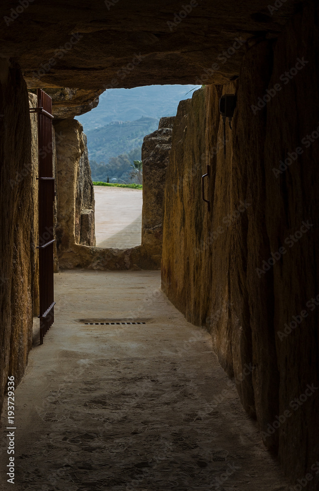 Obraz premium The Dolmen de Viera is in the Spanish town of Antequera. View of the entrance to the dolmen. 3rd millennium BCE.