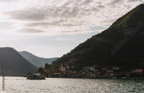 panorama view of Lake Iseo in Lombardy with water train, Italy