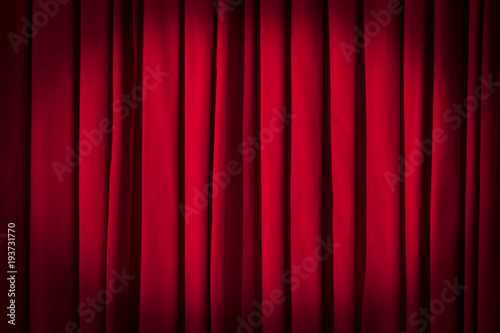 Red curtain theater background with folds, shadows and highlights.