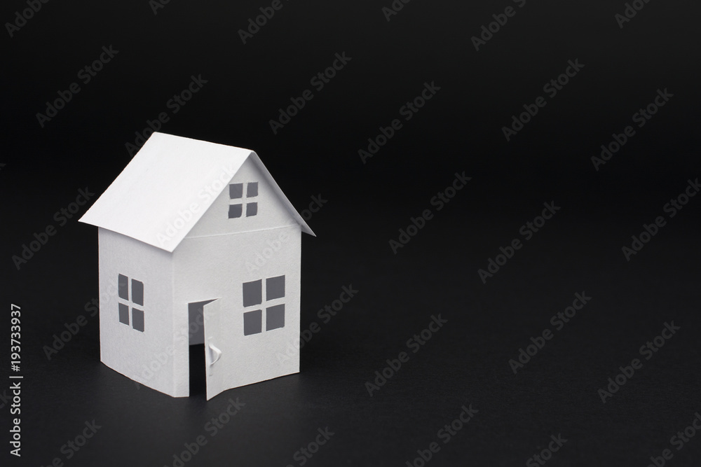 white small house on blurred dark background, close up, selective focus Real Estate concept white small house on blurred dark background, close up, selective focus Real Estate concept