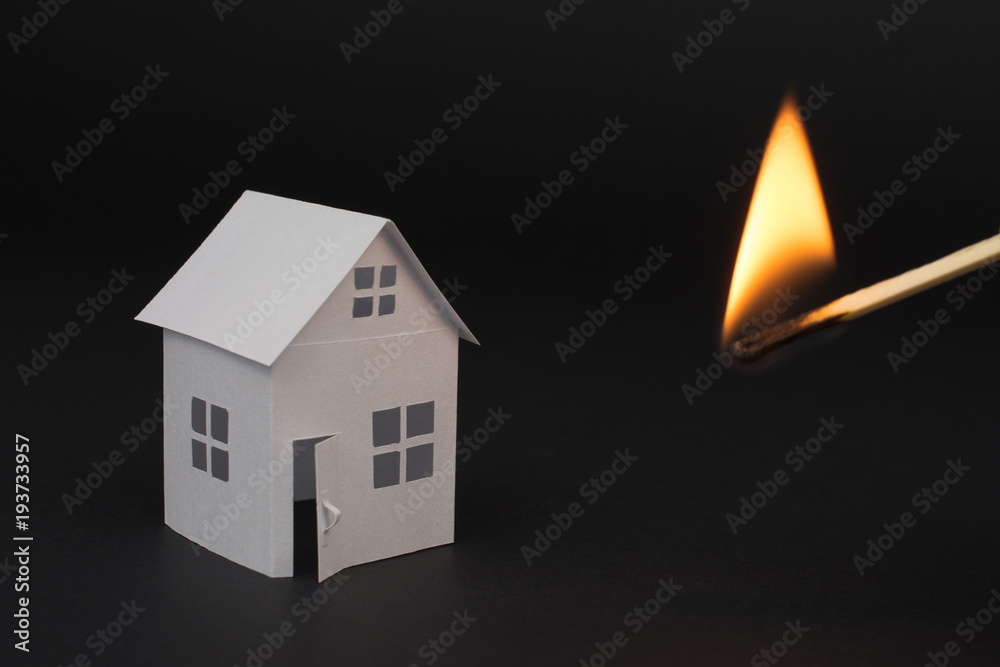 white small house on blurred dark background, close up, selective focus Fire Insurance and Real Estate concept white small house on blurred dark background, close up, selective focus Fire Insurance and Real Estate concept