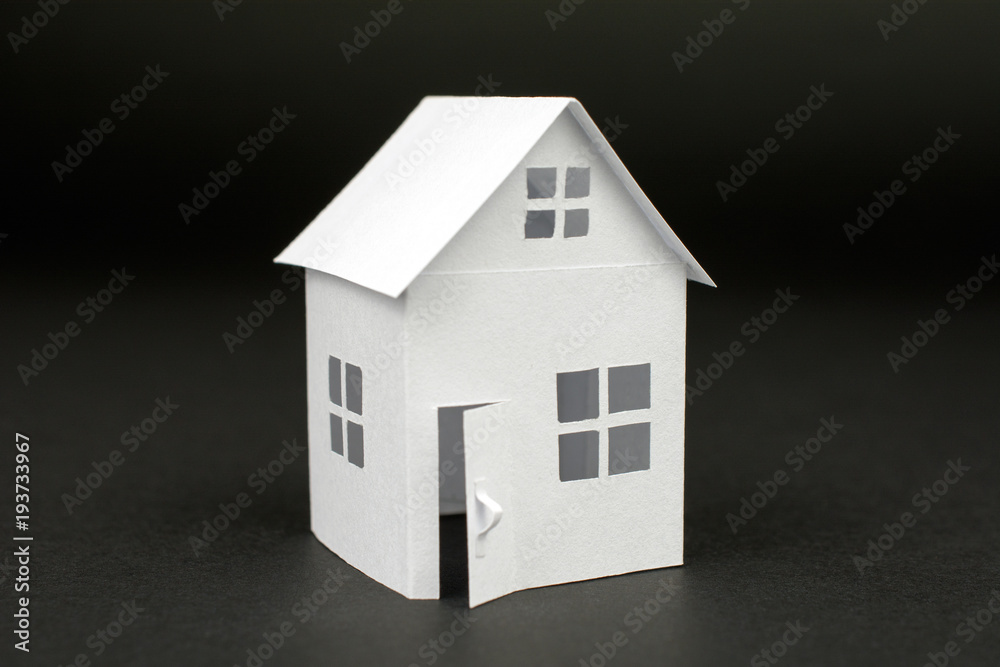 white small house on blurred dark background, close up, selective focus Real Estate concept white small house on blurred dark background, close up, selective focus Real Estate concept