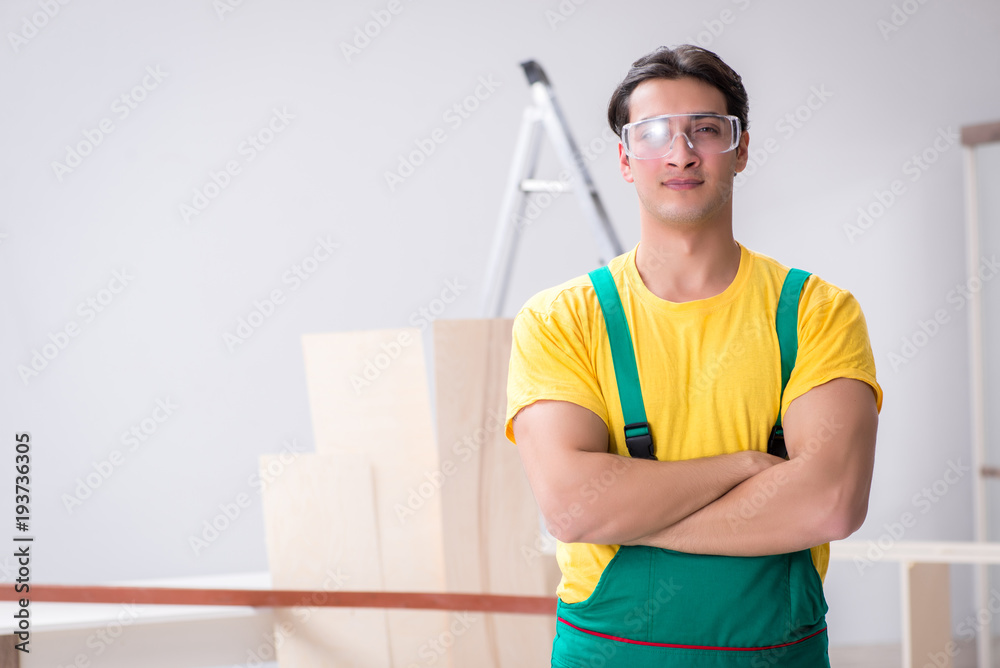 Worker wearing protective goggles at construction site