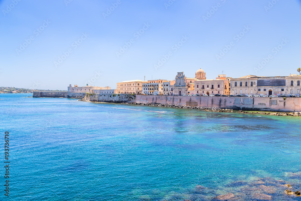 Syracuse, Italy. Quay of the island of Ortygia: Maniace Castle (1232-1240) and the Church in the name of the Holy Spirit, 1727 - 1797. The island is wholly included in the UNESCO list