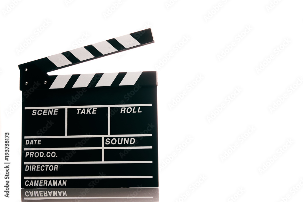 Fototapeta premium Clapper board isolated on white background with copy space. Movie production clapper board, close-up. Wooden black clapper board front view.