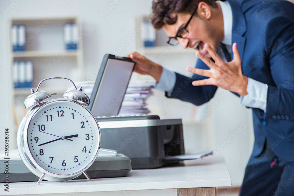 Businessman making copies in copying machine