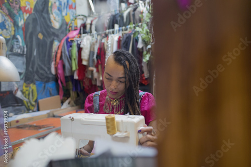 Young female designer working at studio