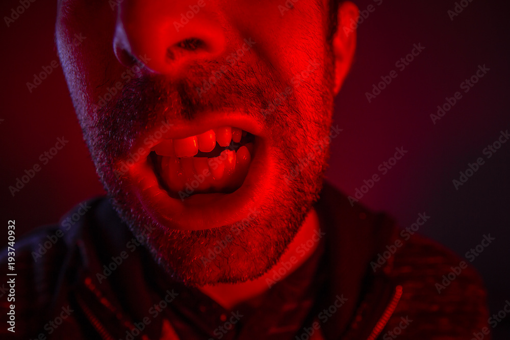 Man with angry facial expression screaming out loud Man with angry facial expression screaming out loud