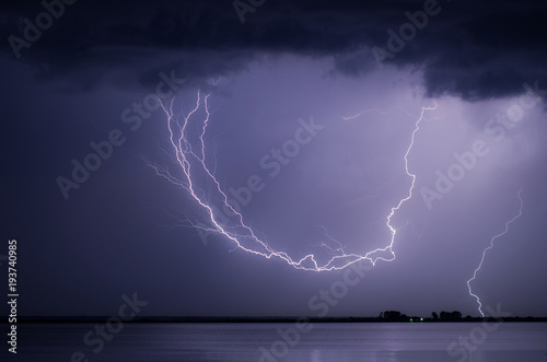 Arched lightning over lake in Serbia.