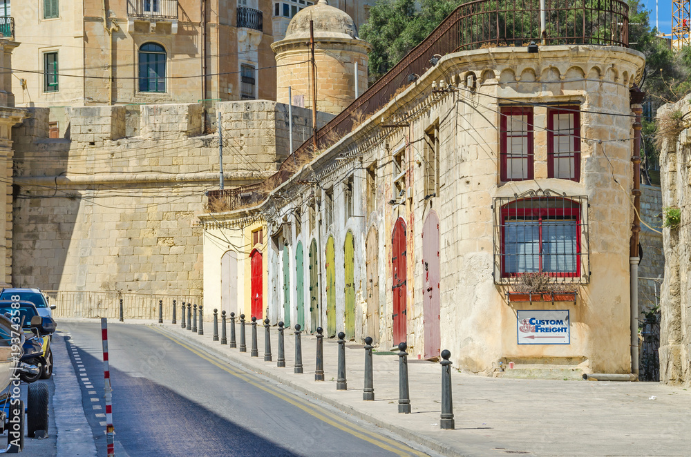 A typical narrow street with colorfull doors in Valletta