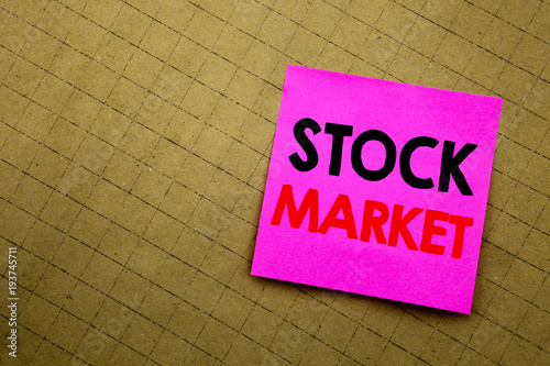 Handwritten text caption showing Stock Market. Business concept writing for Equity Share Exchange written on sticky note paper on the yellow background.