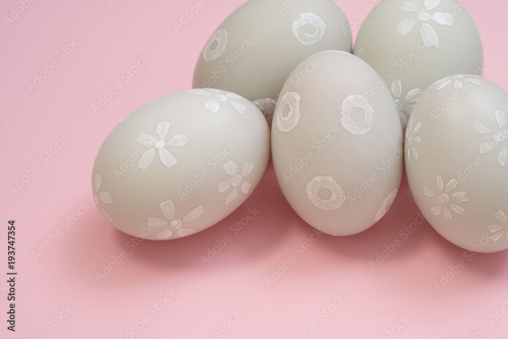 handmade easter eggs isolated on a pink background.
