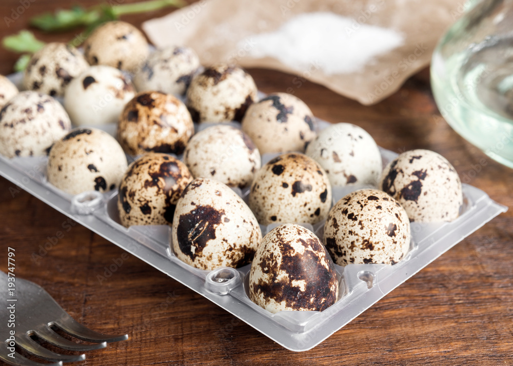 uncooked quail eggs on classic rustic wood uncooked quail eggs on classic rustic wood
