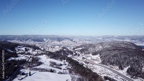 Aerial footage of approaching Drammen city along e18 highway in Norway photo