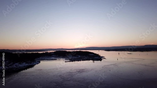 Wallpaper Mural Aerial shot of islands in Oslo fjord towards sun at sunset in winter Torontodigital.ca