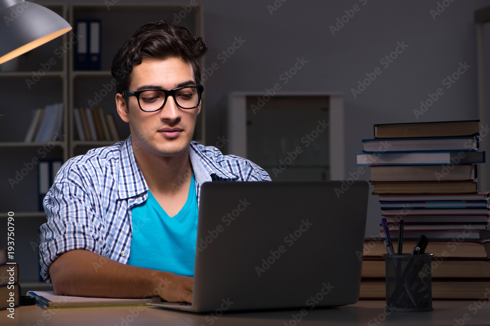 Student preparing for exams late night at home Student preparing for exams late night at home