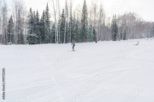 The ski slope. Ski slope in the forest. Beautiful winter forest in the taiga. Trees under the snow. Track for skiers.