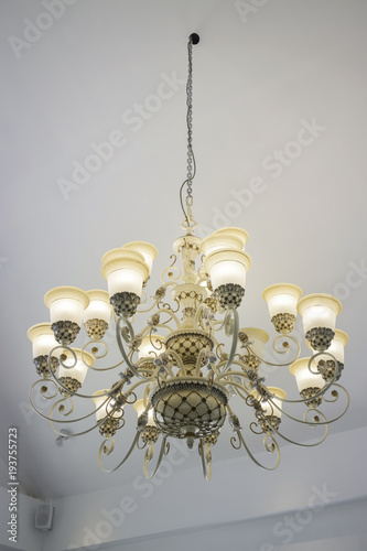 Vintage chandelier light bulb in dark room