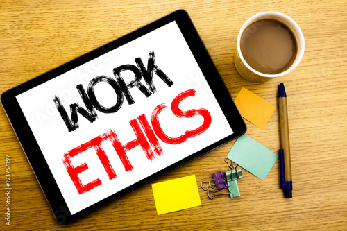 Handwritten text caption showing Work Ethics. Business concept writing for Moral Benefit Principles Written on tablet laptop, wooden background with sticky note, coffee and pen