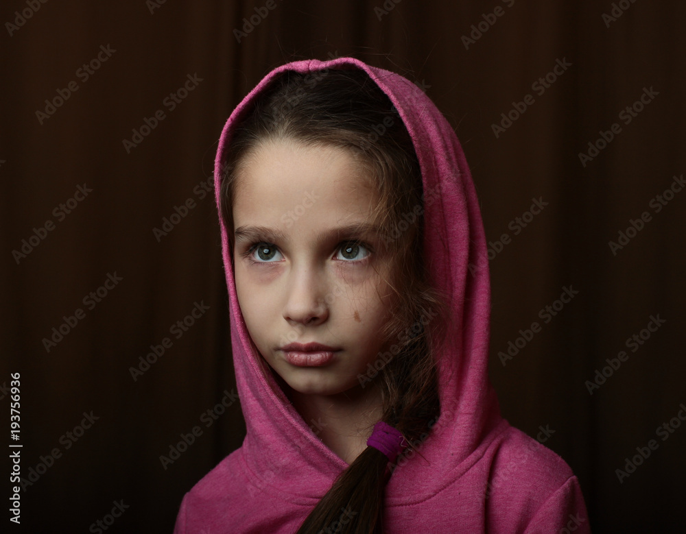 piercing gaze of a girl on a dark background piercing gaze of a girl on a dark background
