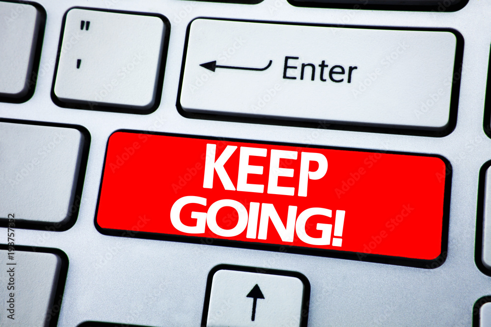 Handwriting Announcement text showing Keep Going. Business concept for Go Moving Forward Letting written on red key on the keybord background.