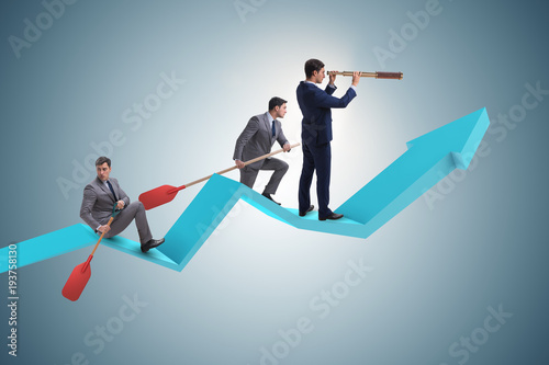 Businessman on line chart in business concept