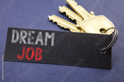 Handwritten text showing Dream Job. Business concept writing for Dreaming About Career Written on note paper attached to the key, black background with space close up © Artur