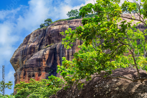 View of the top of the Sigiriya Lion Rock against the sky with clouds. Sri Lanka