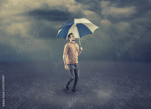 Young man holding an umbrella