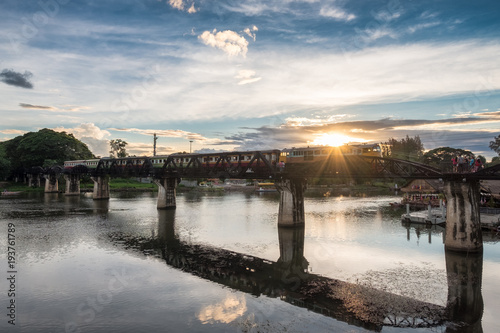 Ancient train running on bridge in River Kwai landmark of Kanchanaburi