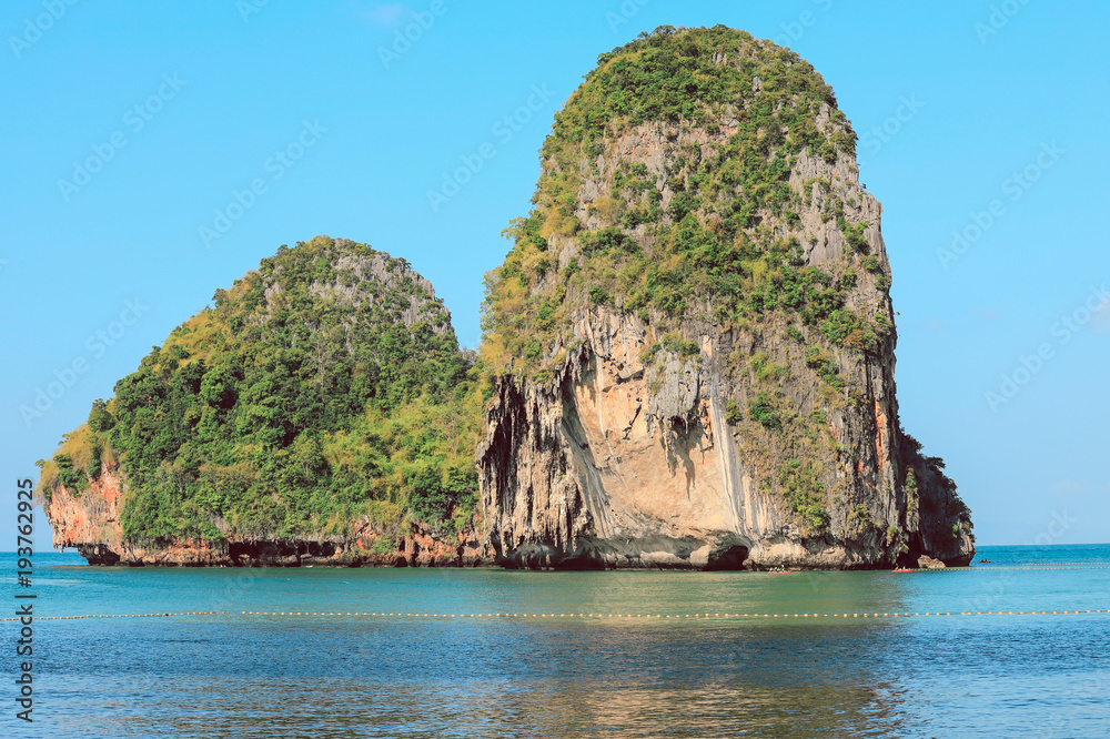 Picturesque sea landscape with limestone mountains. Beautiful tropical island in Thailand. Picturesque sea landscape with limestone mountains. Beautiful tropical island in Thailand.
