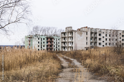 Old destroyed an abandoned multi-storey building in a military town