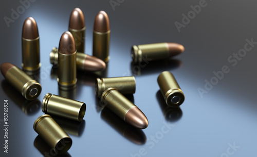 Pistol cartridges of caliber 9 mm on gray background.