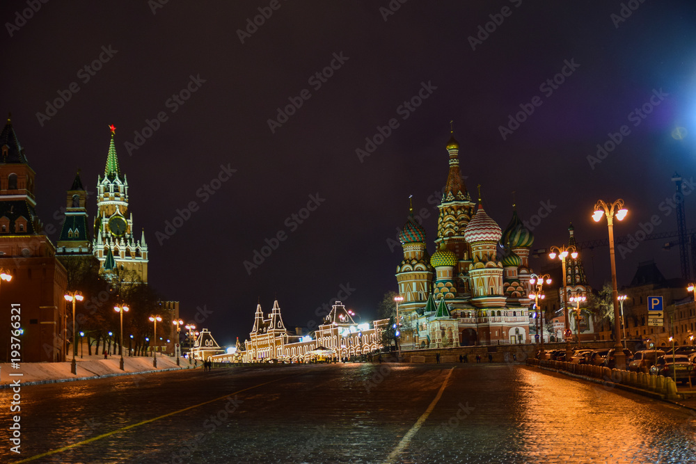 View of the Red square and the Cathedral at night and in the evening in winter