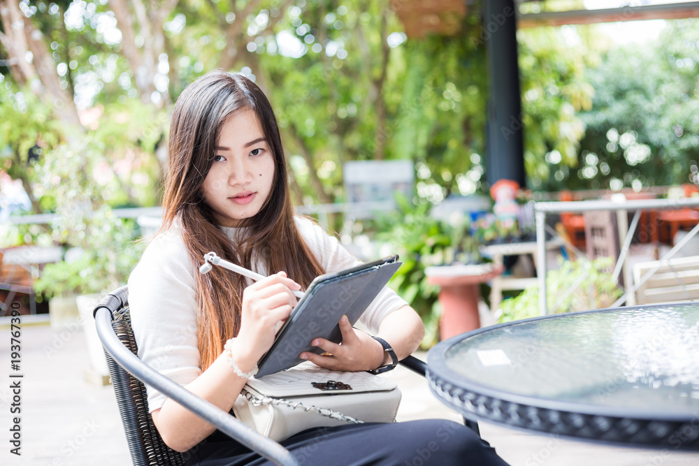 Entrepreneur women use tablet for business plan making
