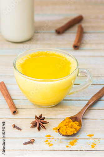 Golden turmeric milk with cinnamon. Healthy and aromatic detox beverage